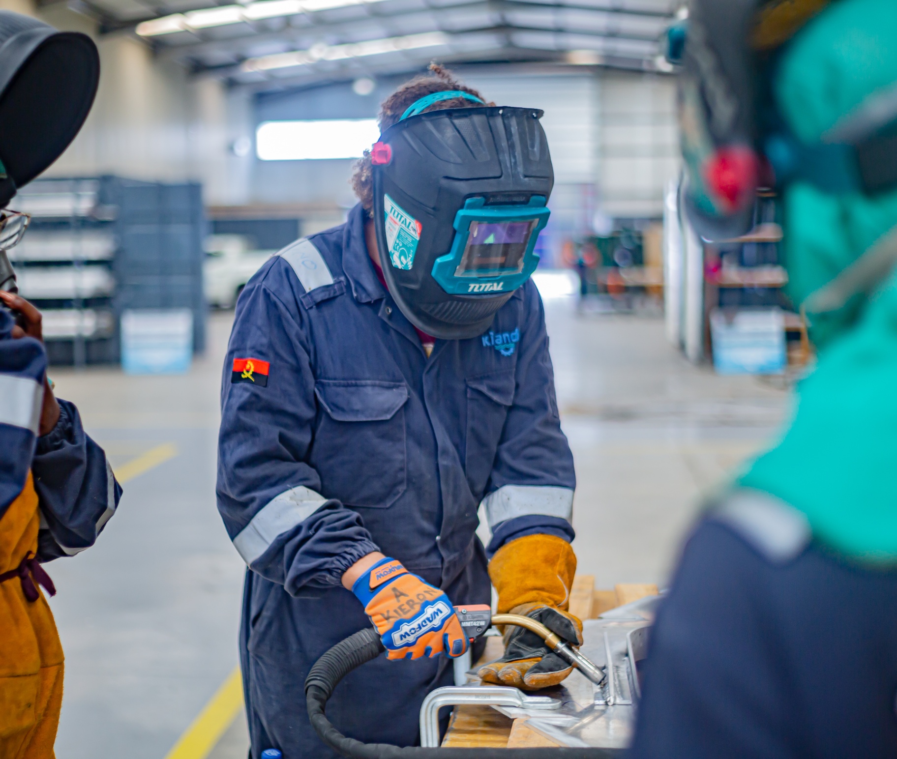 Kianda welder at work in the fabrication hall